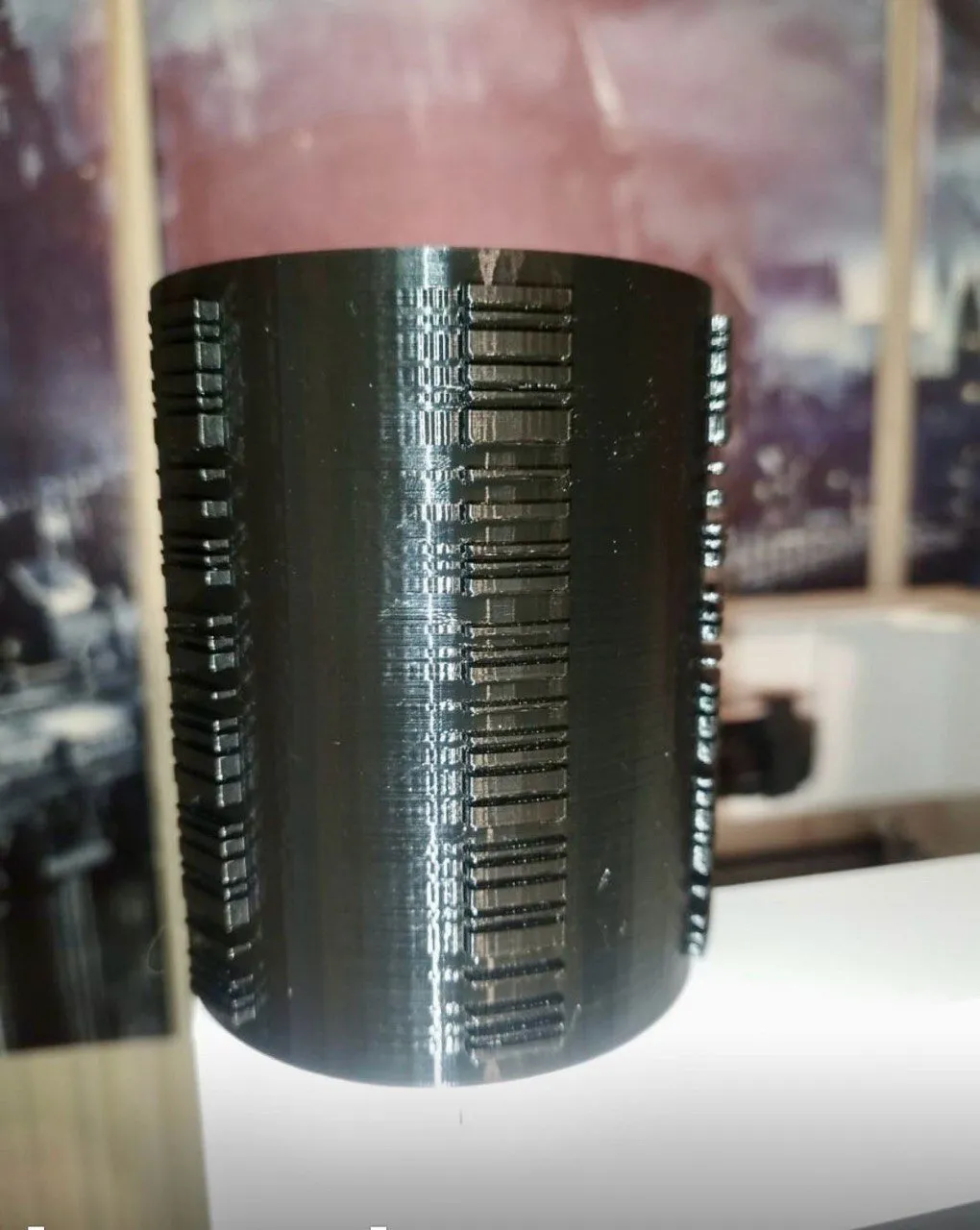 Black roller with the code in relief